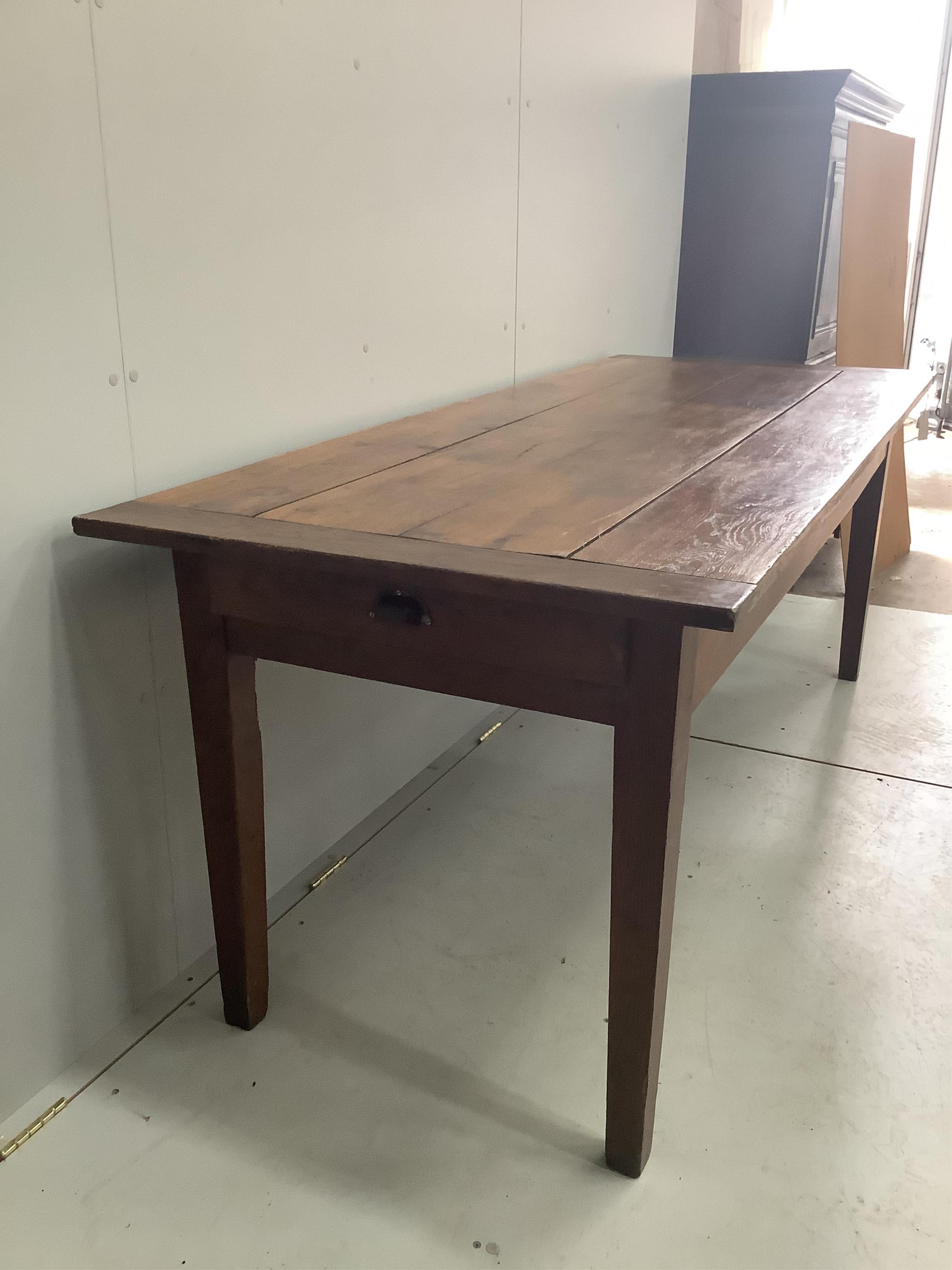 A 19th century French rectangular oak kitchen table, width 201cm, depth 80cm, height 78cm. Condition - fair